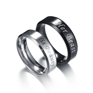 Beauty and Beast couple rings set in silver and black stainless steel with engravings