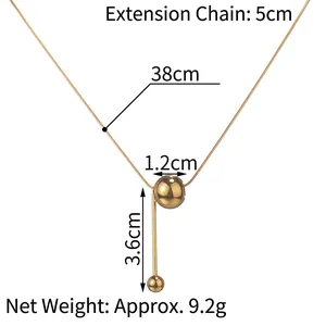 Minimalist gold tassel necklace with round pendant and bar detail dimensions
