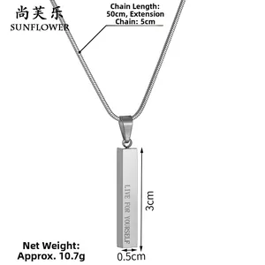 Detailed macro view of silver cylindrical pendant engraved with Live For Yourself quote