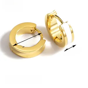 Detail view of gold hoop earrings with white enamel inlay showing 1.3cm diameter size