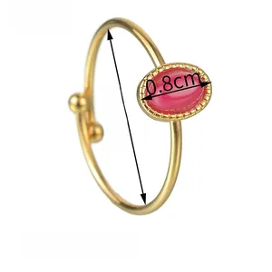 Detailed view of gold oval ruby ring dimensions showing 1.9cm inner diameter and 0.8cm gem