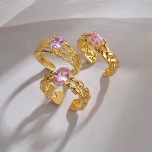 Three-piece set of vintage gold plated stainless steel open rings with pink zircon stones