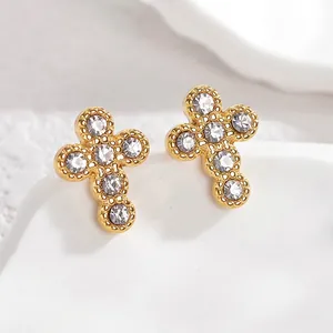 Elegant gold cross earrings with white cubic zirconia and vintage beaded texture details