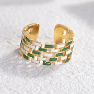 Adjustable gold plated steel ring with green and white enamel checkerboard pattern