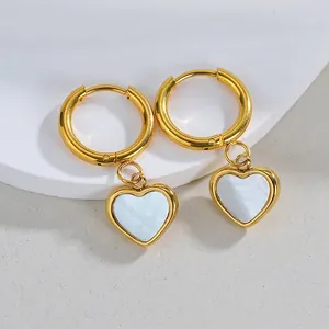 Vintage 18K gold heart hoop earrings featuring white mother of pearl inlay on white stone
