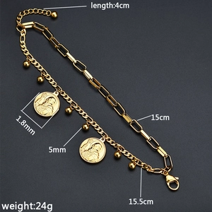 Close-up of gold fringe bracelet showing link styles, coin charms and dimensions
