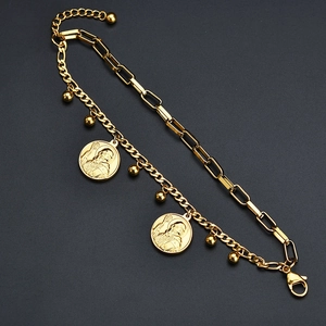 Gold double-layered bracelet with paperclip and Cuban chains featuring saint coin charms