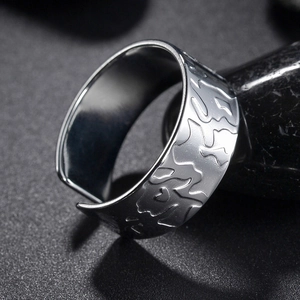 Men's wide geometric stainless steel ring with irregular rock texture and open design