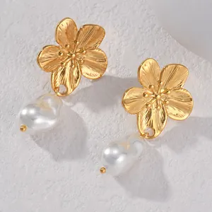 Golden flower earrings with textured petals and elegant baroque pearl drops for women