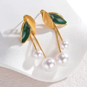French vintage long tassel pearl earrings with green enamel leaves on gold stand