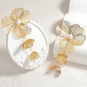 Elegant gold flower tassel earrings with pearls and hollow metal floral design for women