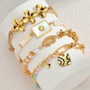 Elegant gold-plated stainless steel bracelet set with geometric flower and pearl charms