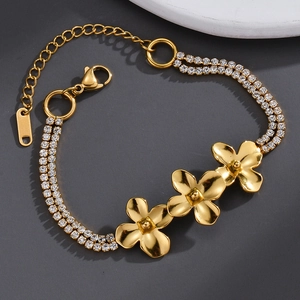 Detail of gold floral bracelet with double row diamonds and adjustable lobster clasp