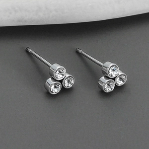 Minimalist round sparkling diamond stud earrings in polished silver titanium steel