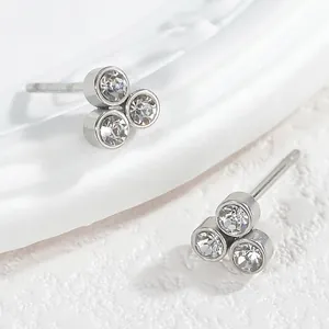 Minimalist silver titanium steel stud earrings with three-cluster round cubic zirconia