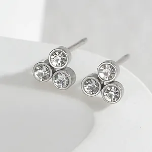 Minimalist silver titanium steel stud earrings featuring three clustered round diamonds