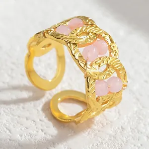 Vintage gold plated geometric open ring with hollow woven texture and pink crystal beads