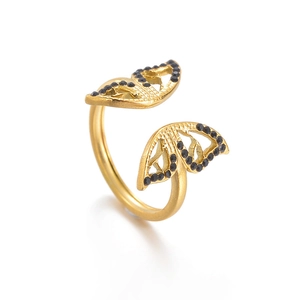 Elegant gold butterfly wing open ring with black micro-stones in a minimalist style
