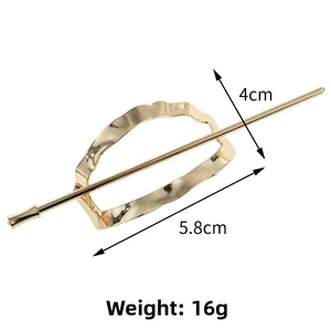 Detail view of gold hollow oval hair pin set with 4cm and 5.8cm size annotations