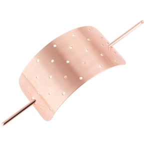 Macro detail of rose gold hollow rectangle hair stick with brushed metal texture