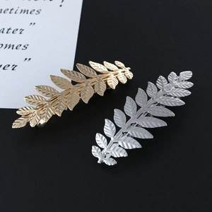Metallic leaf hair clips in gold and silver finish with detailed leaf veins