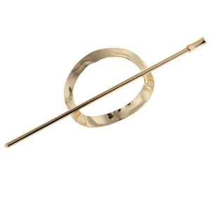 Detailed view of golden metallic hair pin with textured oval hollow ring set