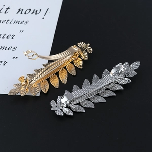 Elegant metallic leaf pattern spring hair clips in polished gold and silver finishes