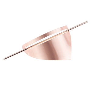 Macro shot of rose gold triangular hair pin featuring a modern brushed metal texture