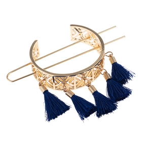 Detail of golden geometric hollow hair crown with blue tassels and matching hairpin