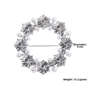 Detailed view of luxury 4cm pearl and red crystal brooch weighing 13.2 grams