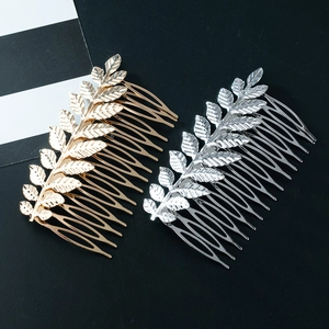 Elegant gold and silver metal leaf hair combs featuring realistic leaf vein textures