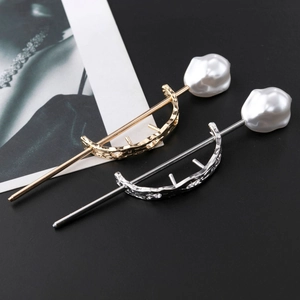 Elegant gold and silver curved hairpins with textured hollow metal and baroque pearls