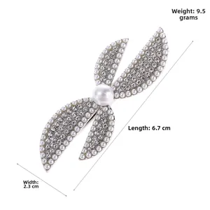 Detail view of pearl and rhinestone hair clip with dimensions 6.7cm by 2.3cm