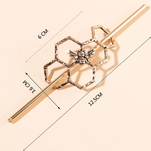 Detailed dimension view of golden honeycomb hair pin with small bee design and measurements