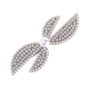 Detailed view of elegant silver butterfly hair clip with faux pearls and rhinestones