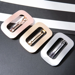 Minimalist rectangular metal hair clips with brushed matte finish in gold and silver