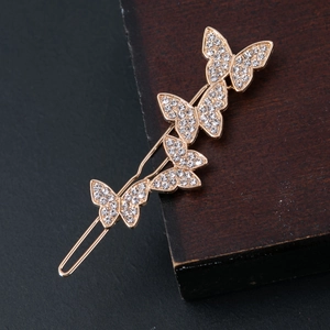 Eleganter goldener Schmetterlings-Haarclip-Set mit funkelnden Kristallen in Reihenform