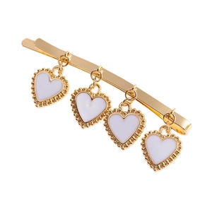 Elegant gold metal hair clip with four hanging white heart pendants in a sweet style