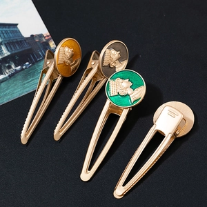 Vintage gold alloy hair clips with colorful portrait cameos in retro artistic style