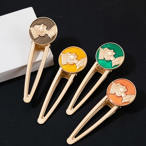 Set of four vintage European portrait metal hair clips with colorful enamel finish