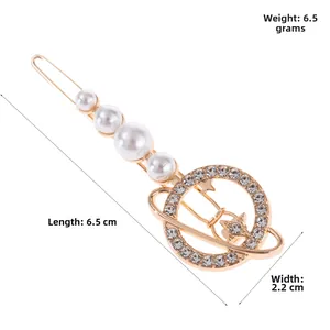 Detailed view of alloy hair clip with white pearls and rhinestone planet planet design