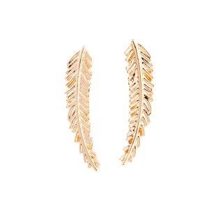Detailed macro view of gold-finished feather leaf ear crawlers with fine engraved textures