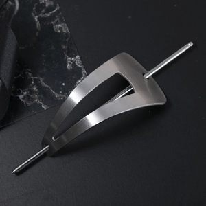Minimalist silver geometric metal hair clip set with brushed finish on dark background