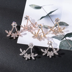 Detail of floral petal ear jackets in gold, silver, and rose gold with sparkling crystals