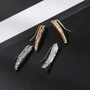 Leaf crawler earrings in gold and silver finish with detailed vein texture