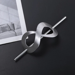 Brushed silver infinity symbol hair pin accessory shown from a 45-degree angle