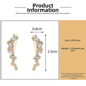 Détail des boucles d'oreilles dorées montrant la taille 2,9x0,8cm et le poids 3,85g