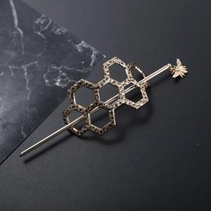 Golden honeycomb hair pin with bee pendant and hand-hammered texture for women