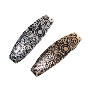 Vintage steampunk metal hair clip set with mechanical gear patterns in silver and bronze