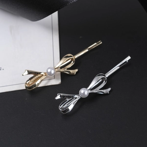 Barrettes à cheveux élégantes en forme de nœud dorées et argentées avec perle centrale
